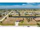 Expansive aerial view of a home, with a canal, and lush landscaping at 39 Bunker Pl, Rotonda West, FL 33947