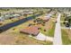 Captivating aerial shot of a home, situated near a canal at 39 Bunker Pl, Rotonda West, FL 33947