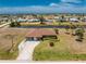 Scenic aerial view of a home, surrounded by landscaping, in a vibrant community at 39 Bunker Pl, Rotonda West, FL 33947