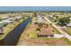 Stunning aerial view of a home with a waterway at 39 Bunker Pl, Rotonda West, FL 33947