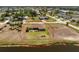 Aerial view of a single-Gathering home featuring a fenced backyard and waterfront access at 39 Bunker Pl, Rotonda West, FL 33947