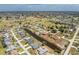 A captivating aerial view showcasing a single-Gathering home in a waterfront community at 39 Bunker Pl, Rotonda West, FL 33947