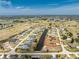 Aerial shot of a single-Gathering home situated near a golf course community at 39 Bunker Pl, Rotonda West, FL 33947