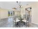 Open-concept floorplan featuring dining area with tile floor adjacent to kitchen at 39 Bunker Pl, Rotonda West, FL 33947