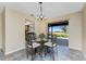 Bright dining area features backyard access for indoor/outdoor living at 39 Bunker Pl, Rotonda West, FL 33947