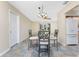 Dining area features tile flooring with kitchen access and a doorway to the bedrooms at 39 Bunker Pl, Rotonda West, FL 33947