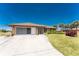 Lovely single-story home with palm trees, complemented by a neat front lawn at 39 Bunker Pl, Rotonda West, FL 33947