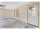 Bright living room boasts tile floors, neutral paint, and front door with decorative glass at 39 Bunker Pl, Rotonda West, FL 33947