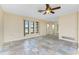 Open-concept living area with neutral color palette and tile flooring throughout at 39 Bunker Pl, Rotonda West, FL 33947
