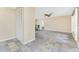 Bright living space with tiled floors, neutral paint, and access to bedroom and dining area at 39 Bunker Pl, Rotonda West, FL 33947