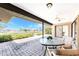 Covered patio with ceiling fan, stylish furniture and picturesque water views at 39 Bunker Pl, Rotonda West, FL 33947