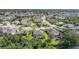 Beautiful aerial view of a well-maintained neighborhood with lush landscaping and serene ponds at 4004 Landor Ct, Venice, FL 34293