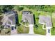 Aerial view of the property, surrounded by lush greenery, and close proximity to neighboring houses at 4004 Landor Ct, Venice, FL 34293