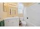 Bathroom features a white vanity with sink and cabinet and a shower-tub combination at 4004 Landor Ct, Venice, FL 34293