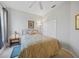 Comfortable bedroom with a bed, small side table, a lamp, and a spacious closet at 4004 Landor Ct, Venice, FL 34293