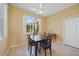 Cozy dining area featuring a ceiling fan and natural light streaming through a window at 4004 Landor Ct, Venice, FL 34293