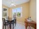 Bright dining area featuring a window overlooking the pool and backyard at 4004 Landor Ct, Venice, FL 34293