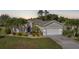 Well maintained home with verdant landscaping, palm trees and neutral toned paint at 4004 Landor Ct, Venice, FL 34293