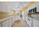 Spacious kitchen with white cabinetry and stainless steel appliances at 4004 Landor Ct, Venice, FL 34293