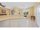 Open kitchen view showcasing a breakfast bar and adjacent dining area at 4004 Landor Ct, Venice, FL 34293