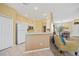 Bright kitchen with white appliances, ample counter space, and seamless transition to the living area at 4004 Landor Ct, Venice, FL 34293
