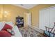 Living room with sofa, bookshelf and view into adjacent room at 4004 Landor Ct, Venice, FL 34293