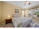 Serene bedroom featuring a queen-size bed, soft lighting, and picturesque window view at 4004 Landor Ct, Venice, FL 34293