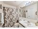 Bathroom featuring a vanity with a sink, a large mirror, and a shower with a curtain at 4410 Warren Ave # 306, Port Charlotte, FL 33953