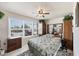 Comfortable bedroom with a ceiling fan, natural light from a window, and closet storage at 4410 Warren Ave # 306, Port Charlotte, FL 33953