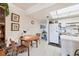 Cozy kitchen and dining area features tiled floors, and a bright white kitchen at 4410 Warren Ave # 306, Port Charlotte, FL 33953