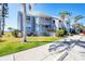 Charming waterfront condo featuring two stories with balconies, lush landscaping, and dedicated parking at 4410 Warren Ave # 306, Port Charlotte, FL 33953