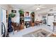 Inviting open-concept living area with tropical decor and easy access to the kitchen at 4410 Warren Ave # 306, Port Charlotte, FL 33953