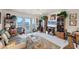 Comfortable and well-lit living area with access to a balcony and stylish furnishings at 4410 Warren Ave # 306, Port Charlotte, FL 33953