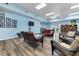 Inviting lounge with cozy seating, a TV, and a bookshelf, creating a comfortable and relaxing atmosphere at 4410 Warren Ave # 306, Port Charlotte, FL 33953