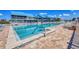 Waterfront community pool and lounging area offer outdoor recreation and relaxation at 4410 Warren Ave # 306, Port Charlotte, FL 33953