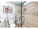 Nicely appointed bathroom with a spacious glass shower and neutral tile finishes at 5000 Gasparilla Rd # 23A, Boca Grande, FL 33921