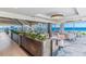 Elegant dining area with beach views, featuring modern decor, and comfortable seating at 5000 Gasparilla Rd # 23A, Boca Grande, FL 33921