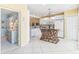 Bright kitchen featuring white cabinets, appliances, and a unique center island with a woven base at 5000 Gasparilla Rd # 23A, Boca Grande, FL 33921