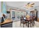 A view of the dining room featuring a wooden dining set and view of the back yard at 521 Artists Ave, Englewood, FL 34223