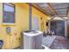 Back exterior of a building, showing the AC unit, shed, and back entrance at 521 Artists Ave, Englewood, FL 34223