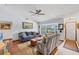 Inviting living room with a vaulted ceiling, ceiling fan, and plenty of natural light at 521 Artists Ave, Englewood, FL 34223