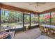 Inviting screened patio with ample seating and views of the lush garden and plants at 521 Artists Ave, Englewood, FL 34223