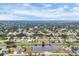 An aerial view showcases the expansive waterfront community with homes and serene lakes at 642 Boundary Blvd, Rotonda West, FL 33947