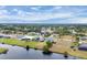 Aerial view of a waterfront community with mature landscaping and well-maintained homes at 642 Boundary Blvd, Rotonda West, FL 33947
