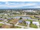 Scenic aerial view of a house, showcasing water access, lush landscaping and neighboring homes at 642 Boundary Blvd, Rotonda West, FL 33947