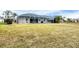 Spacious backyard with a screened-in pool, perfect for relaxation and outdoor activities at 642 Boundary Blvd, Rotonda West, FL 33947