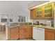 Bright kitchen featuring granite counters, stainless steel sink, and plenty of cabinet space at 642 Boundary Blvd, Rotonda West, FL 33947