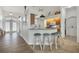 Open kitchen with granite countertops, tile flooring, and bar seating at 642 Boundary Blvd, Rotonda West, FL 33947