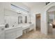 Elegant main bathroom featuring a double sink vanity and natural lighting at 642 Boundary Blvd, Rotonda West, FL 33947