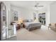 Large main bedroom featuring neutral colors, natural light and a sliding glass door to the pool area at 642 Boundary Blvd, Rotonda West, FL 33947